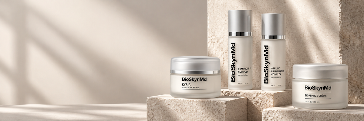 BioSkynMd skincare serums and creams displayed on warm stone pedestals